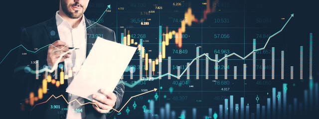 Poster - Businessman analyzing financial report with stock market holograms and data charts overlayed on dark background in a futuristic office setting.