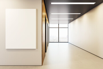 Poster - Vertical blank canvas mockup on wall in modern empty office corridor with city view through large window in corporate building interior design. 3D Rendering