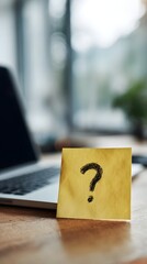 Poster - A question mark on a sticky note placed on a laptop screen in a casual work setting