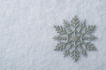 Poster - Sparkling ornamental snowflake against a winter landscape with space for a message