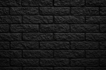 Poster - Dark brick surface with jagged edges on a black wall background