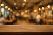 © AkuAku - Abstract blurred backdrop featuring a wooden surface and a dining setting with bokeh effects