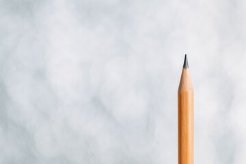 Poster - Blurry abstract backdrop featuring a pencil, ideal for wallpapers, templates, educational purposes, and more. Stunning standalone pencil on a clean white surface.