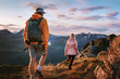 © EVERST - Couple friends hiking in sunset mountains travel in Norway, hikers group man and woman backpacking summer adventure active vacations, healthy lifestyle outdoor trip family trekking journey in the wild