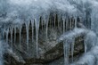 © Emin - Winter ice formations creating stalactites on rocks