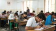 © N7 - Defocused college classroom with Indian students preparing for written examination