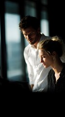 Poster - Manager and assistant planning weekly workflow at desk with daylight