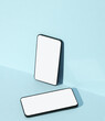 © splitov27 - Two Smartphones on blue background with shadow. Creative layout.