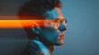 © Parol - Profile of a man wearing glasses with orange light streak across his face in a blue tinted scene
