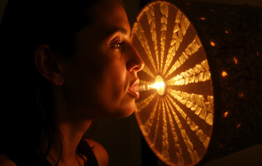Poster - Woman's Profile with Illuminated Radial Patterned Lamp