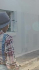 Poster - Animation of light spots over woman using scooter on street