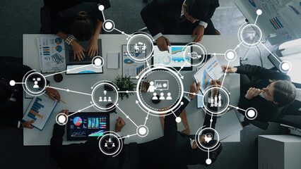 Poster - A dynamic business meeting showcasing collaboration among professionals, featuring data visualization tools and strategic planning in a modern office setting. Amity