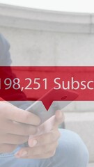 Poster - Increasing subscribers on red speech bubble against mid section of a man using smartphone