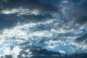 Wall Mural - Beautiful bright sunset sky background with clouds.  Evening time.