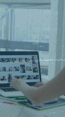 Aufkleber - Animation of graph and changing numbers over asian woman working over laptop and desktop