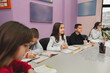 © Jelena - Group of elementary students learning together at language school