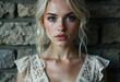 © starush - Close-up portrait of a young woman with blonde hair and blue eyes against a stone wall background