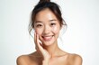 © Viktor - Beautiful young Asian woman with clear fresh skin smiling brightly. Face healthy glow from facial treatment, cosmetology. Close-up portrait highlights natural beauty, skincare for radiant look.