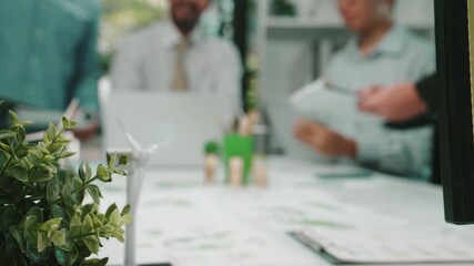 Poster - A diverse group of professionals engaged in a collaborative business meeting in a modern office setting, exchanging ideas and analyzing documents to drive innovation. SACTR