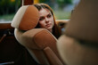 © SHOTPRIME STUDIO - Pensive young woman leaning on car seat, lost in thought, capturing the essence of nostalgia and tranquility in natural light.
