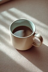 Poster - Coffee Cup on a Table with Soft Natural Sunlight Shadows Creating a Calm Cozy Atmosphere for Relaxation or Breakfast