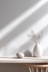 Poster - Minimalist interior scene with white vase containing dried flowers on a shelf with shadow patterns and a smooth stone decoration for modern home decor