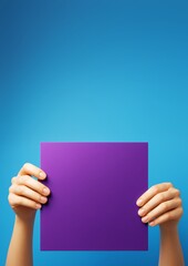 Poster - Hands holding blank purple square poster against clean blue background for advertising or business promotion concept with copy space template.