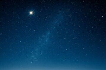 Poster - Bright star glowing in night sky among countless stars and subtle Milky Way trail on deep blue background, peaceful and serene celestial landscape.