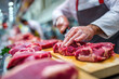 © Emanuel - Butcher preparing fresh meat at a market counter