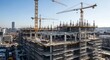 © Ipramana - Construction site showcasing a large building under development with multiple cranes.