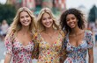 © Kien - Three beautiful, smiling girls in stylish summer dresses posing on a street