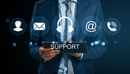 Poster - Businessman holding digital tablet with virtual icons representing customer support communication services in a professional setting.
