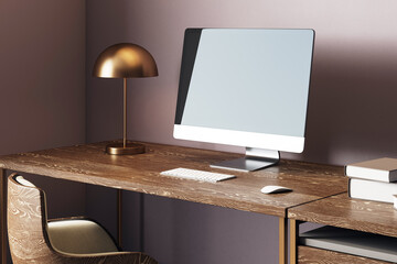 Poster - Cozy workspace with modern computer on wooden desk, bronze lamp, and books in stylish home office interior with dark wall background. 3D Rendering