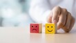 © Zabi - Choosing positive emotions with blocks displaying smiling faces, selecting happiness over sadness and feeling better.