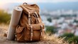 © pvl0707 - Backpack with hiking gear and yoga mat on grassy hill during golden hour with mountain landscape in background