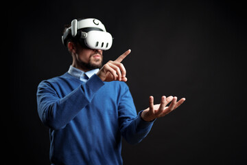 Poster - Virtual reality experience with a man interacting in a dark setting using advanced technology