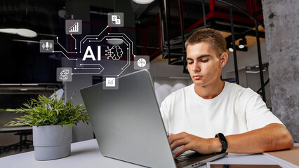 Poster - Young man engages in artificial intelligence project while working on a laptop in a modern office space during the day