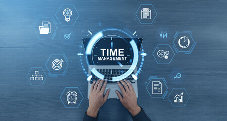 Poster - Time management concept with digital interface icons over laptop and hands typing on keyboard on blue wooden background.