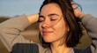 © Gita - Woman with acne enjoying the sun with hands behind her head