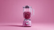 © dinastya - A pink blender filled with pink balls is placed centrally. Concept: monochrome, kitchen appliance, playful