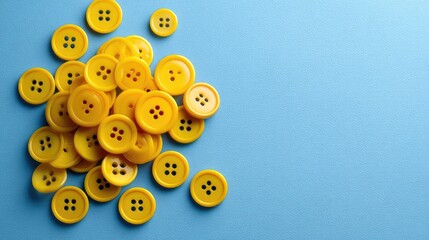 Poster - Bright Yellow Buttons Arranged on a Blue Surface Illustrating Crafting and Sewing Essentials for Creative Projects and DIY Activities in a Stylish and Vibrant Setting