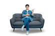 © STOCK88PHOTOGRAPHER - A cheerful young man in a denim jacket sits on a sofa and points to the side, presenting an idea or an advertisement.PNG