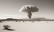 © Valfiyy - Vintage grayscale image depicts atomic bomb explosion over barren desert landscape