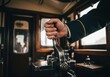 © Aurora Aesthetics - train Conductor Pulling Vintage Lever, a close-up of a railway worker's hand signaling departure in a classic train