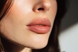 © Oksana Smyshliaeva - Close-Up of Woman Lips with Natural Makeup in Soft Sunlight.