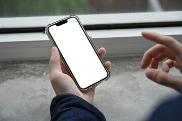Poster - Hand holding a modern phone with blank display, ready for adding custom content or showcasing mobile interface