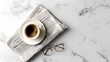 © AI_Vision - A minimalist flat lay of coffee cup eyeglasses and newspaper on marble table in natural light top down perspective
