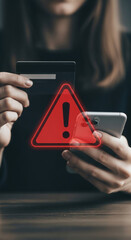 Aufkleber - Close-up of hands holding credit card and phone, with red warning triangle superimposed, illustrating online transaction security risk