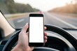 © WE.ARE.AI - Smartphone Mockup. A hand holds a smartphone while resting on the steering wheel, with a blurred highway and trees in the background.