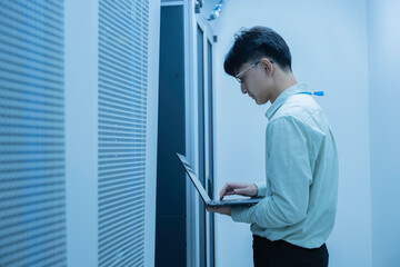computer engineer is setting up network in server room,systems maintenance technician,male engineer 